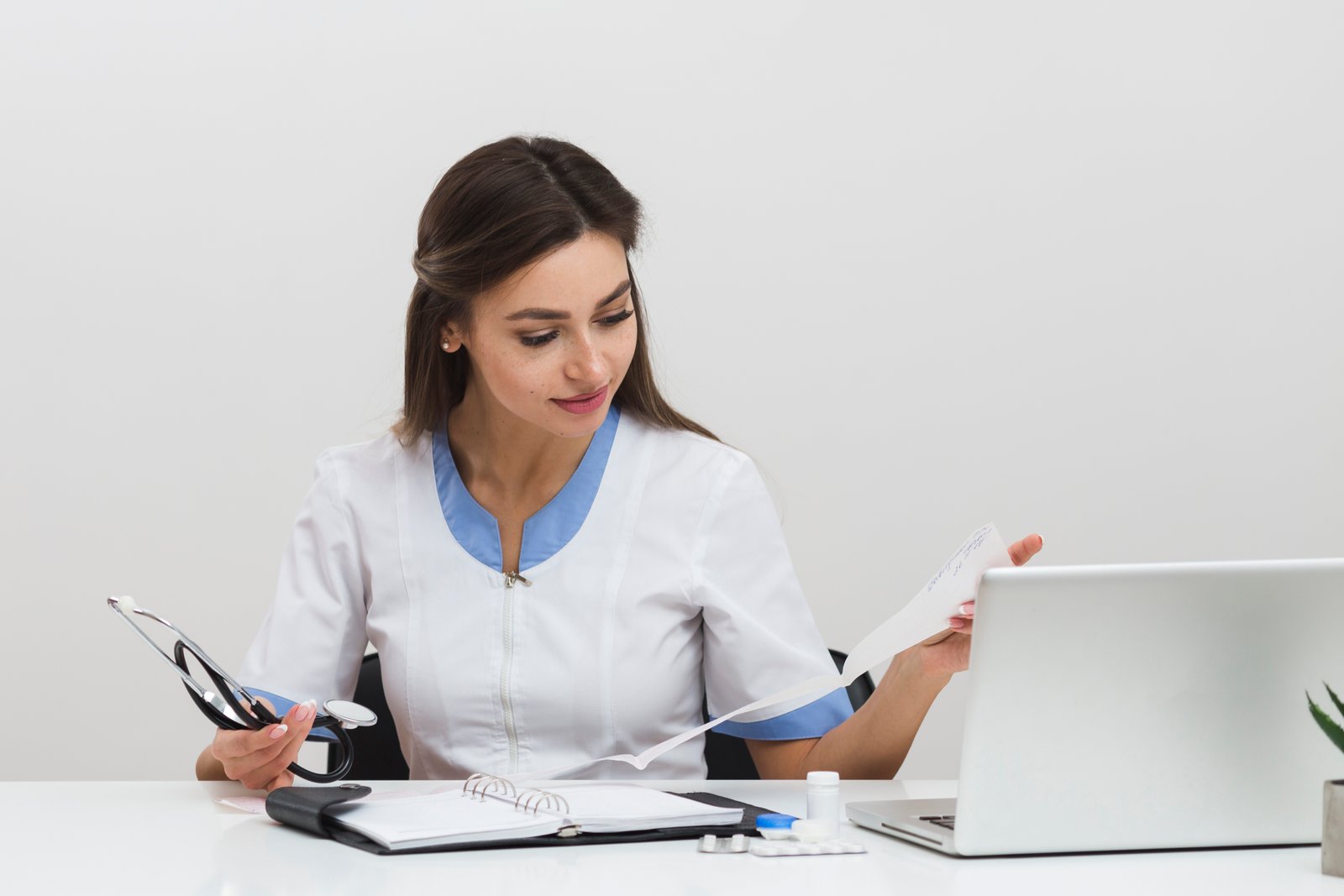 young-female-doctor-looking-n-medical-reports.jpg