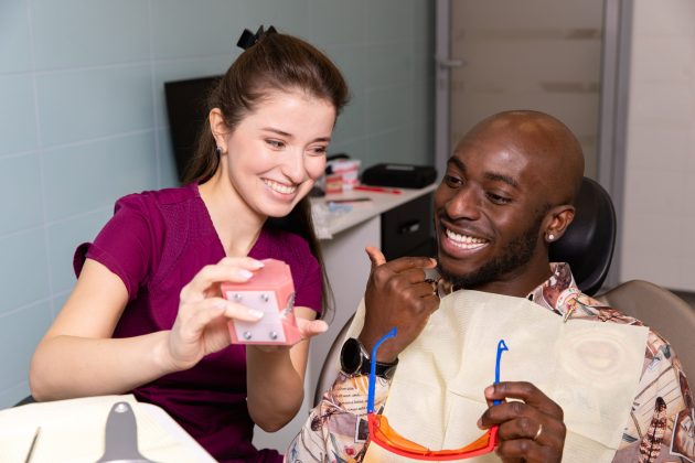 Doctor treats patient teeth in modern dental clinic. High quality photo